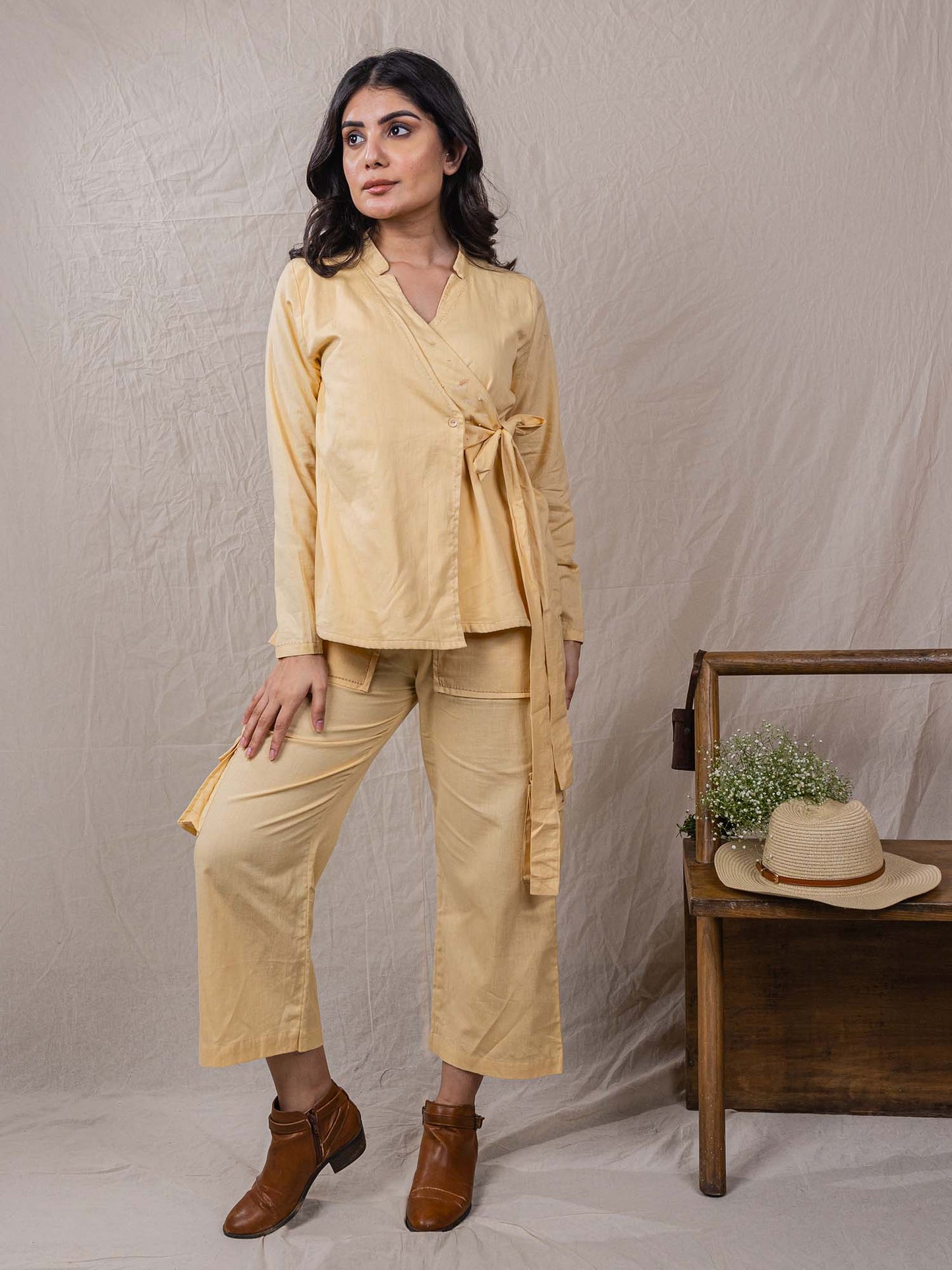 two piece set of top and pants, the overlap look of shirt with flap on one side, cargo pants, leaf embroidery on top, big pockets on cargo