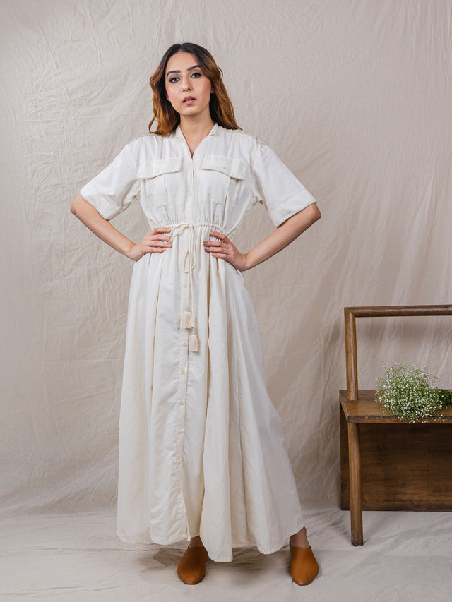 drawstring beige cotton button down dress jacket with two front packets and embroidery details. 