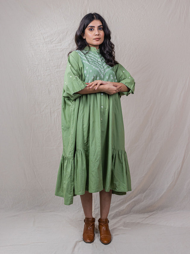 button down cotton dress jacket with elbow length sleeves and handwork details. pale green colour. could be used as a dress or a jacket.