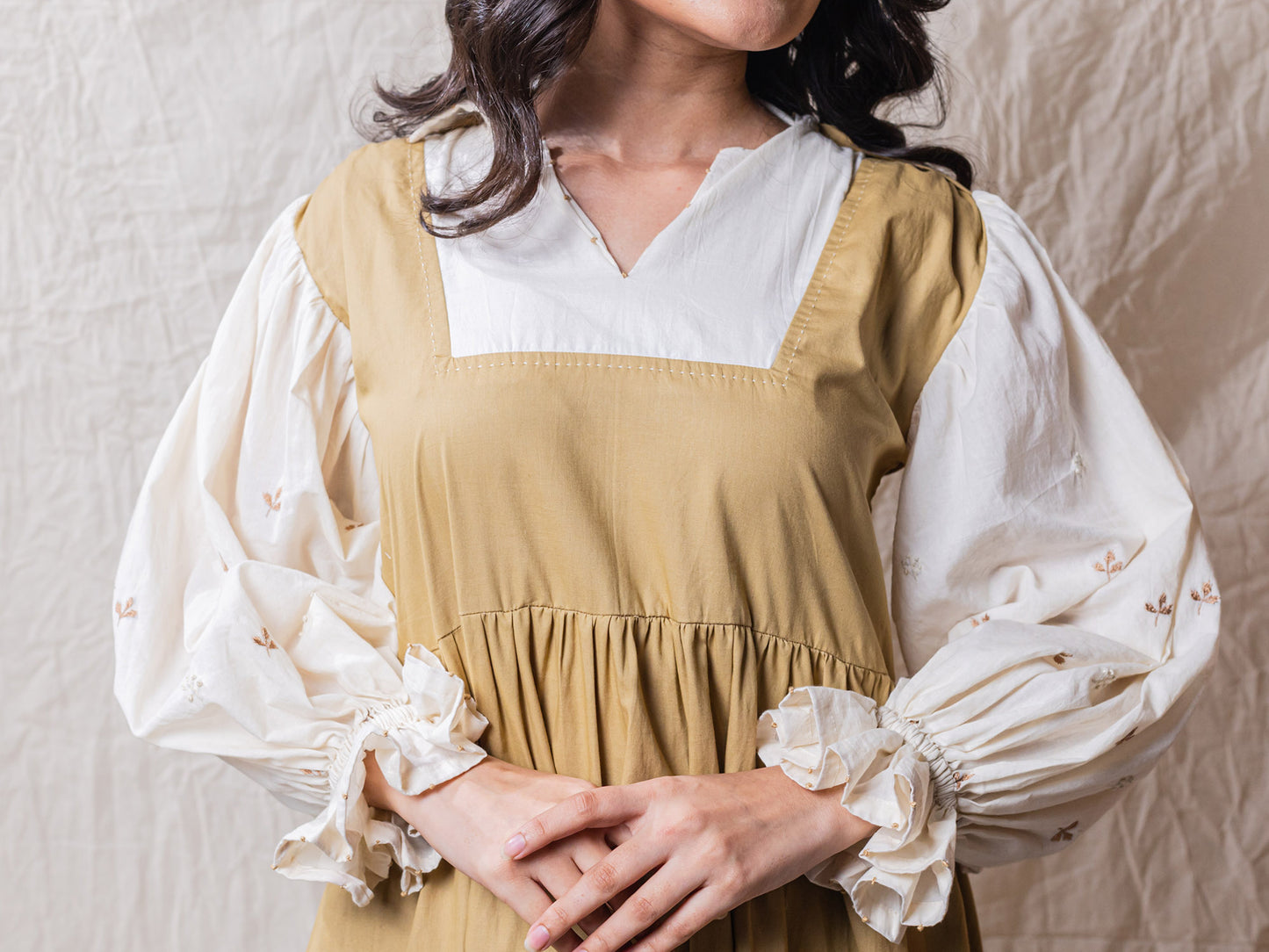 Pod Dress is perfect safari dress with detailed embroidery on sleeve, puff cuffs, attached collar shirt, with square neck dress, tiered bottom with cinched waistline