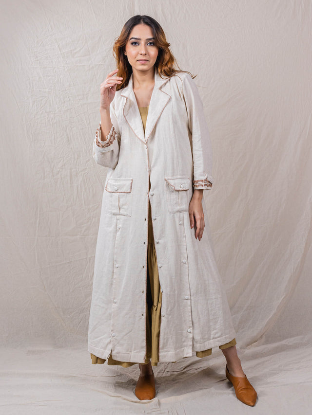 two piece set of dress and jacket, jacket has button down below pockets which can be opened to flaunt the inner tier dress, blanket stitch all over the collar, embroidered cuff and pockets, tier inner dress with beaded hem